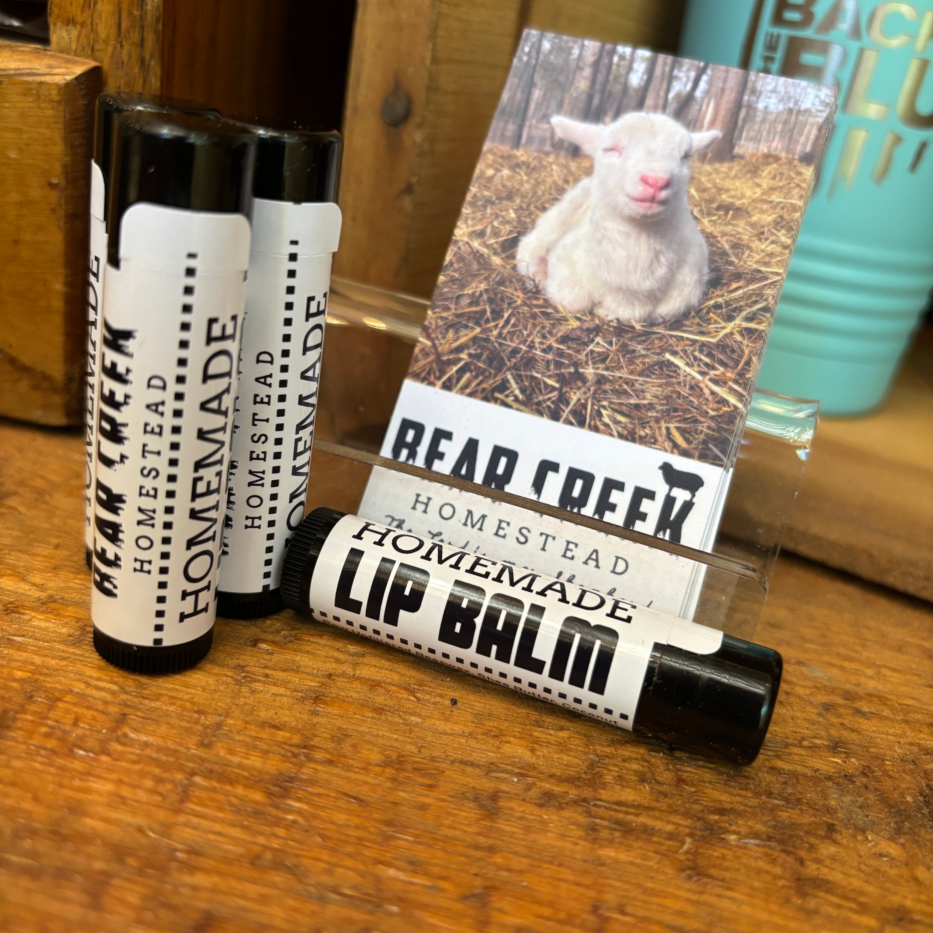 homemade lip balm on display in farm stand