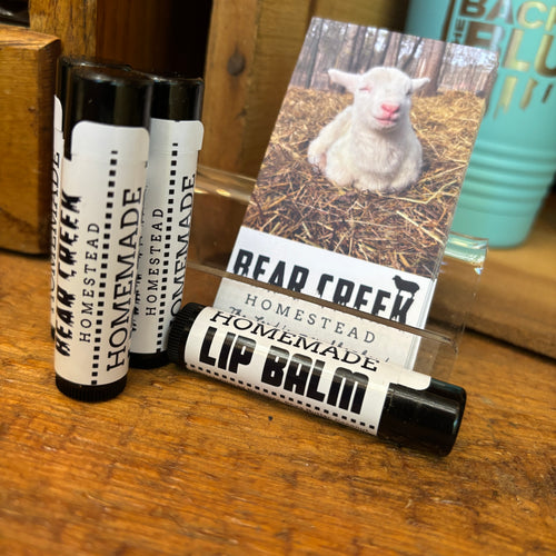 homemade lip balm on display in farm stand